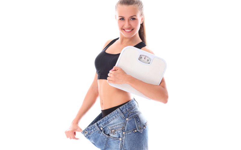 woman with a body fat scale